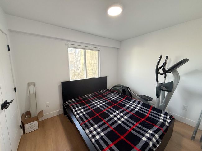 Bedroom featuring baseboards and light wood-type flooring | Image 15