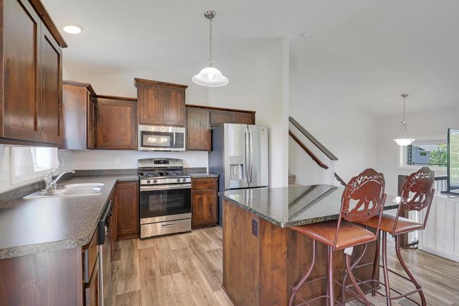 The kitchen offers abundant cabinet and countertop space, providing plenty of room for storage, meal prep, and everyday functionality. | Image 15