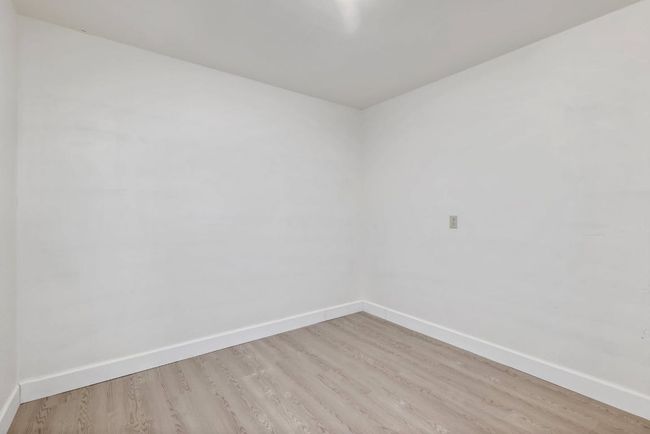 Empty room with baseboards and light wood-style flooring | Image 20