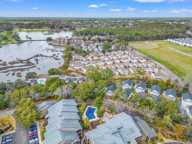Aerial perspective of suburban area with a nearby body of water | Image 36