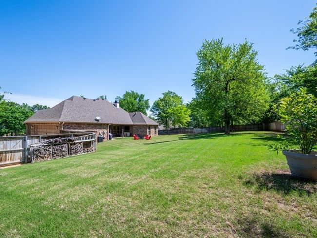 View of yard featuring a fenced backyard | Image 38