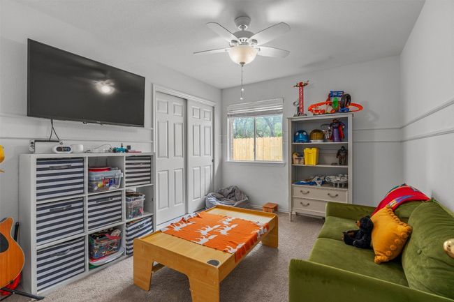 Living room with carpet and a ceiling fan | Image 24