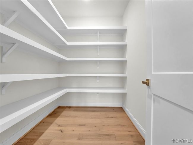 Photo represents the plan, not the actual home. Design selections may vary. The gourmet kitchen features a large island and a walk-in pantry. | Image 5