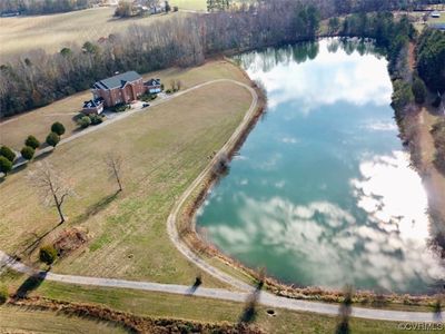 Bird's eye view featuring a water view | Image 2