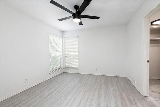 Second bedroom also has ceilling van, LVP floors, and en suite bathroom | Image 8