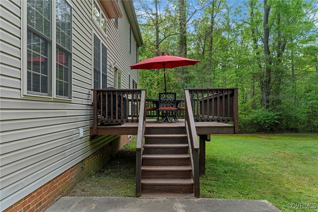 Wooden terrace featuring a lawn | Image 45
