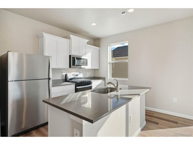 3003 Pershing St, House other with 3 bedrooms, 3 bathrooms and null parking in Strasburg CO | Image 4