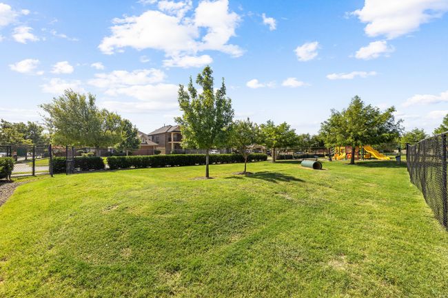 View of yard with fence and playground community | Image 36