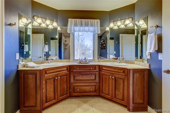 Master bathroom with dual sinks, plenty of storage and natural light | Image 25