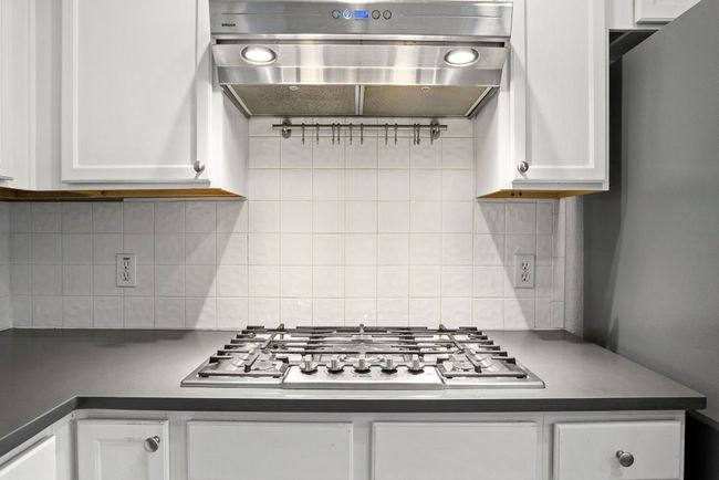 Beautiful gas cooktop cooking area | Image 7