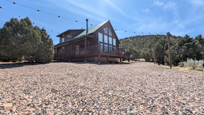 Back of property featuring a deck and metal roof | Image 23
