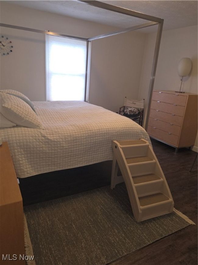 Bedroom featuring dark wood-type flooring | Image 16