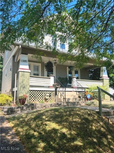 View of front of home featuring covered porch and a front lawn | Image 3