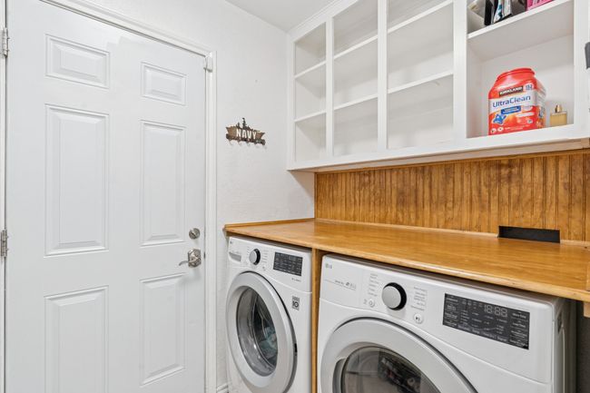Shelves galore and a creatively designed folding table built above the washer and dryer. Washer & dryer can stay, with an acceptable offer! | Image 22