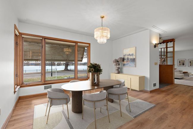 Main Floor Formal Dining Room with lots of windows to capture the Lake and Sunset views! | Image 15