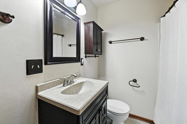 main full bathroom, shower over tub | Image 13