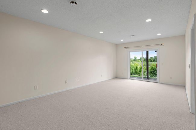 This space can be used for whatever you like, an amusement room, family room, movie space and it all walks out to the backyard. | Image 37