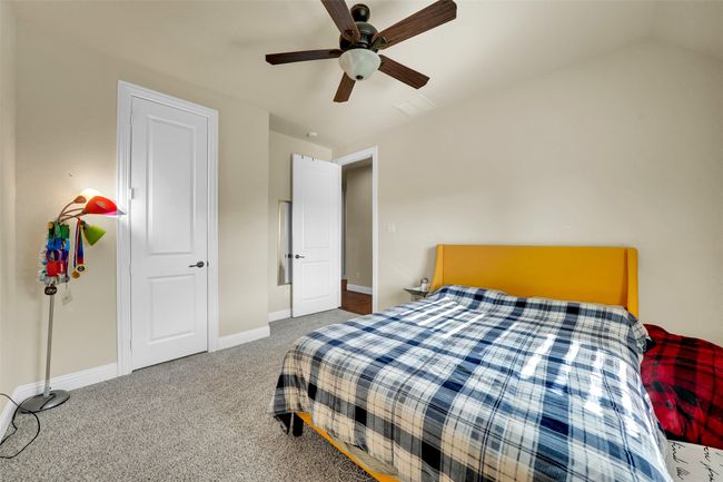Bedroom featuring carpet flooring and ceiling fan | Image 25