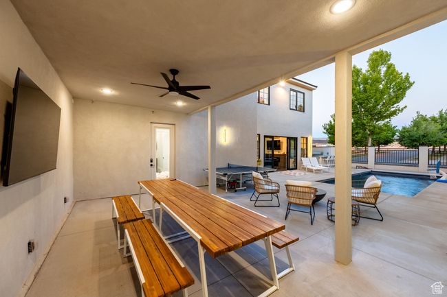 View of patio / terrace featuring a fenced in pool and ceiling fan | Image 28