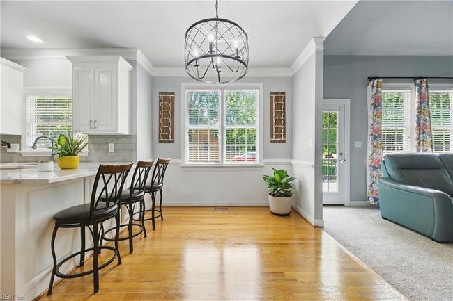 Nestled in between the Family Room and Kitchen, you will find the Breakfast Nook... | Image 7
