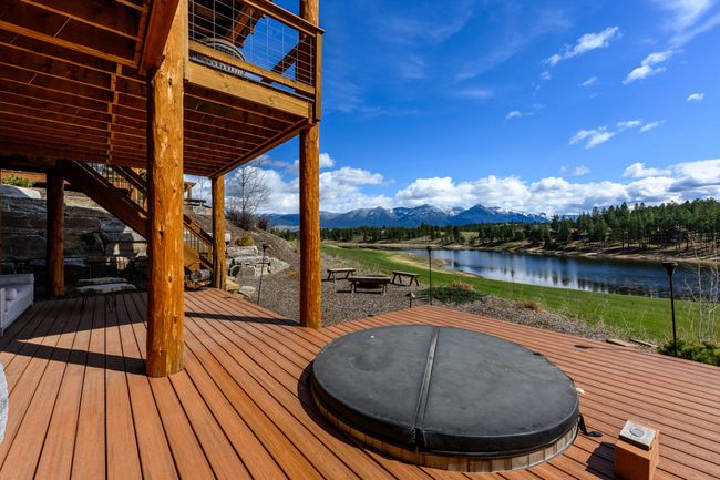 Sunken hot tub on the patio, offering a private oasis with stunning views | Image 33