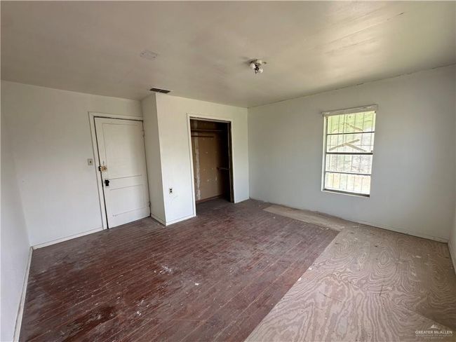 Unfurnished bedroom featuring hardwood / wood-style floors | Image 22