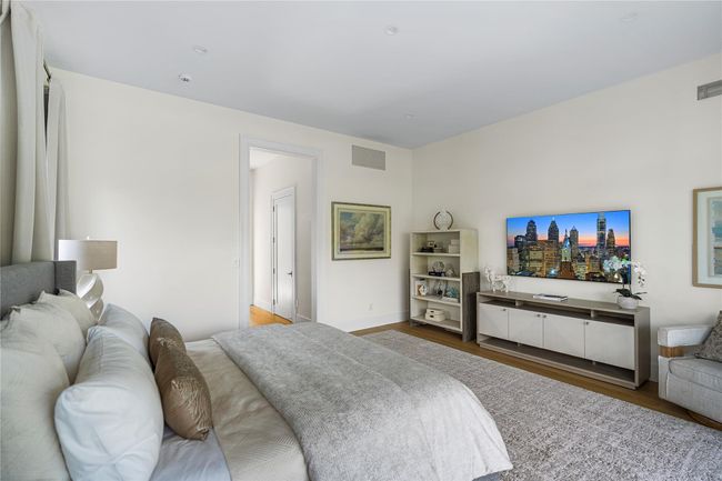 Bedroom featuring wood finished floors and baseboards | Image 26