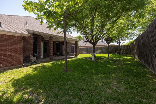 View of yard with a patio area and a fenced backyard | Image 34