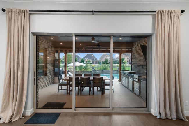Grand slider doors leading to outdoor oasis | Image 11