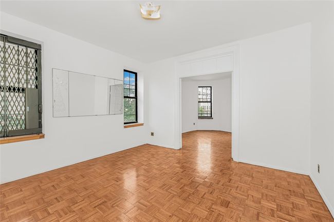 Spare room with baseboards | Image 13
