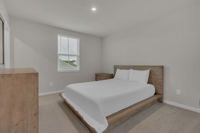 This bedroom (#4) is a bright and versatile room, featuring a generous walk-in closet for all your storage needs. | Image 39