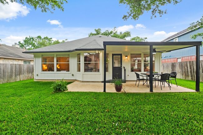 Enjoy a peaceful retreat in the backyard, perfect for unwinding or hosting gatherings. 9349 Bernoulli Dr., Austin, TX 78748 | Image 31