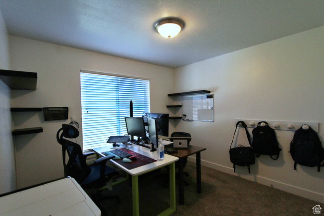 Office space with carpet and baseboards | Image 13