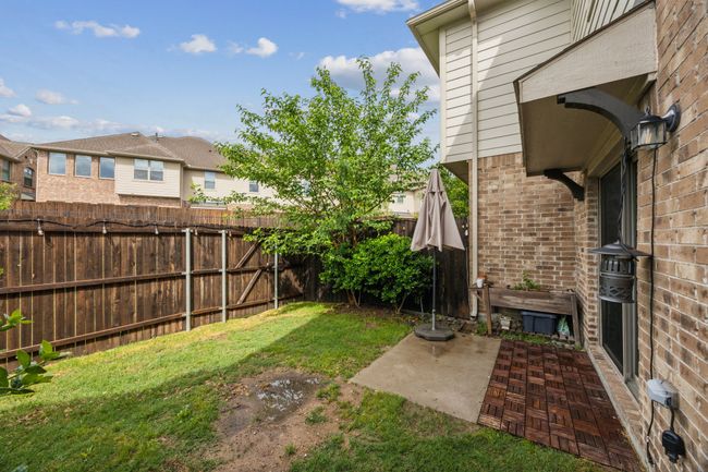 View of yard with a patio area and a fenced backyard | Image 25