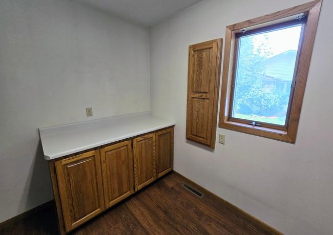 Convenient countertop/cabinet & fold down ironing board | Image 9