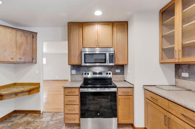 Entryway featuring a sink and baseboards | Image 9
