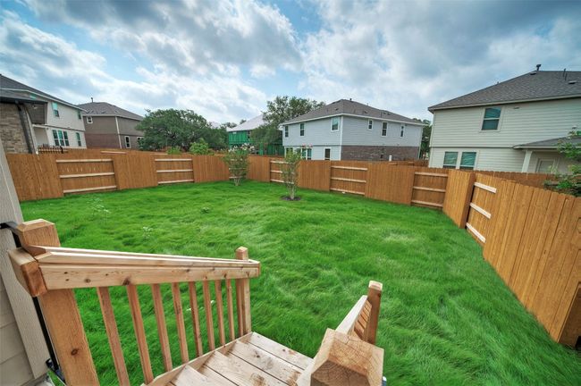 View of yard with a fenced backyard and a residential view | Image 4