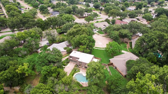 Aerial view of property and surrounding area with nearby suburban area and a pool | Image 35