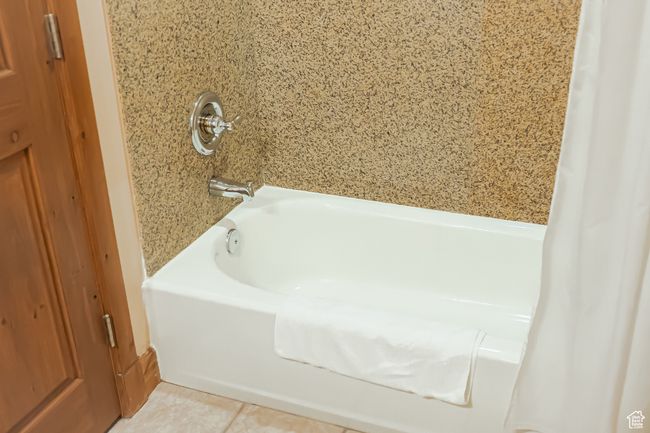 Full bath featuring a washtub and tile patterned flooring | Image 27