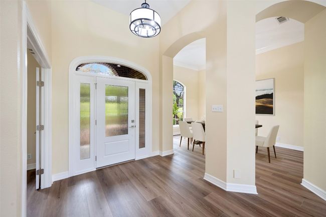 Spacious foyer flanked by formal dining and private office. Virtually staged. | Image 5