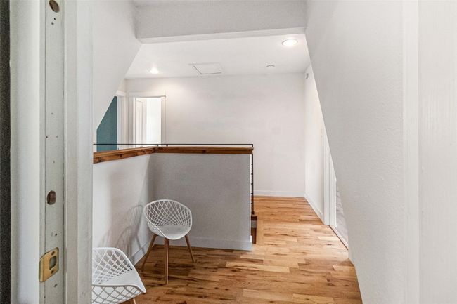 Walk in closet with light wood-style flooring | Image 22