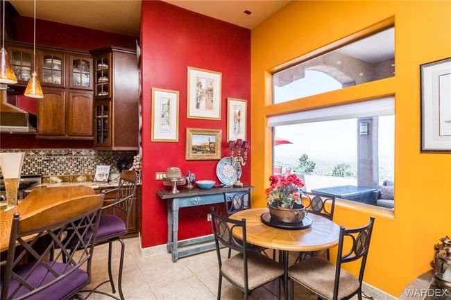 Dining area featuring light tile patterned floors and baseboards | Image 40