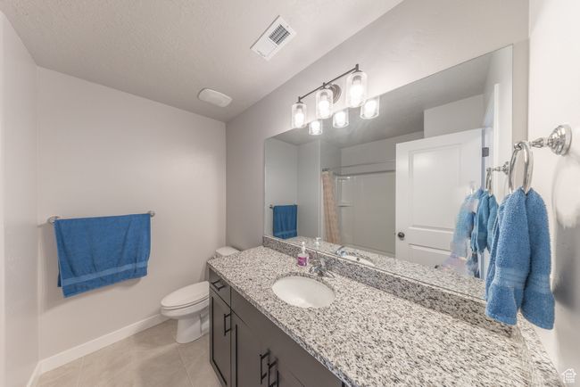 Full bathroom on 2nd floor, featuring vanity, toilet, shower/tub combo. | Image 16
