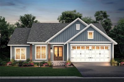 View of front of house featuring a lawn and a garage | Image 3