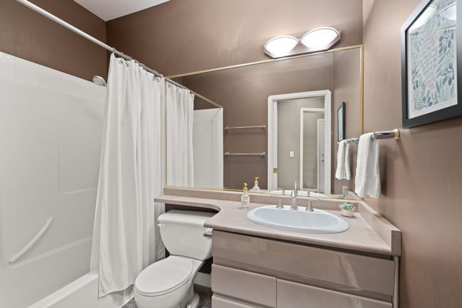 Full bath featuring toilet, shower / bath combo, and vanity | Image 21