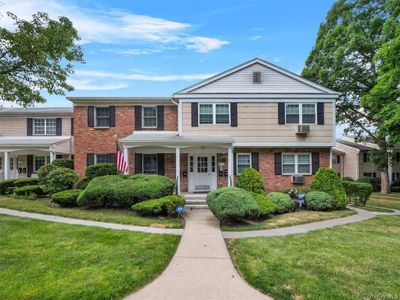 View of front facade with a front lawn and covered porch | Image 3