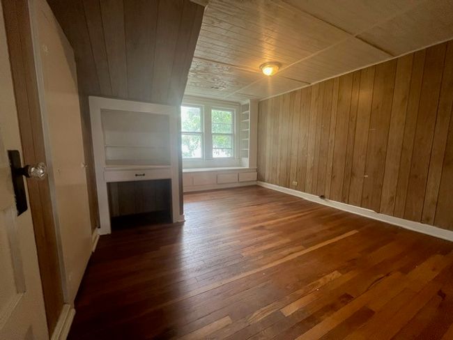 Spare room with wooden ceiling, hardwood / wood-style floors, and wood walls | Image 29