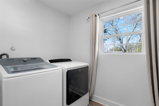 Clothes washing area featuring washer and clothes dryer | Image 27