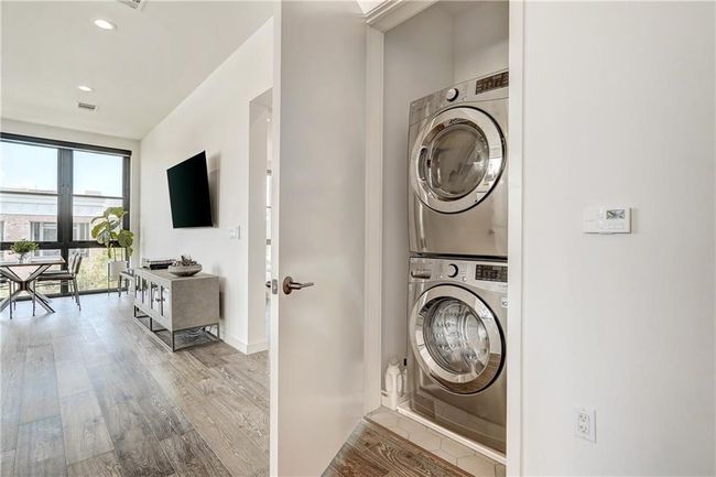 Stackable washer and dryer, conveniently situated in between primary and guest bedrooms. | Image 24