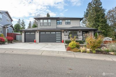 Ease to maintain front yard. Large three car garage. | Image 2